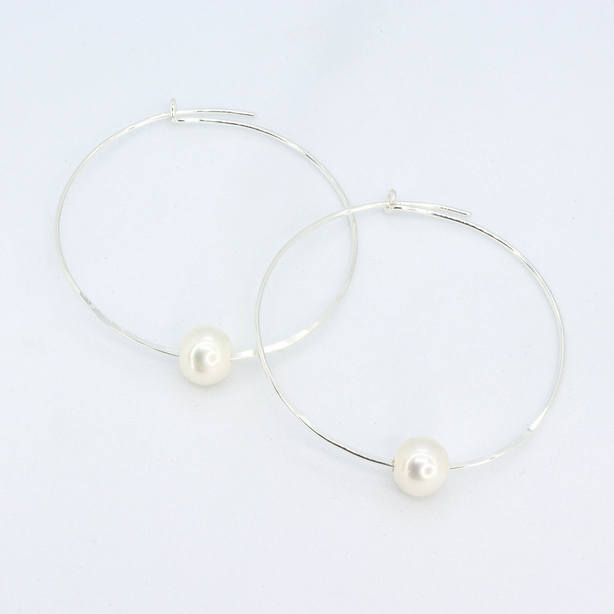 Floating pearl sale hoop earrings